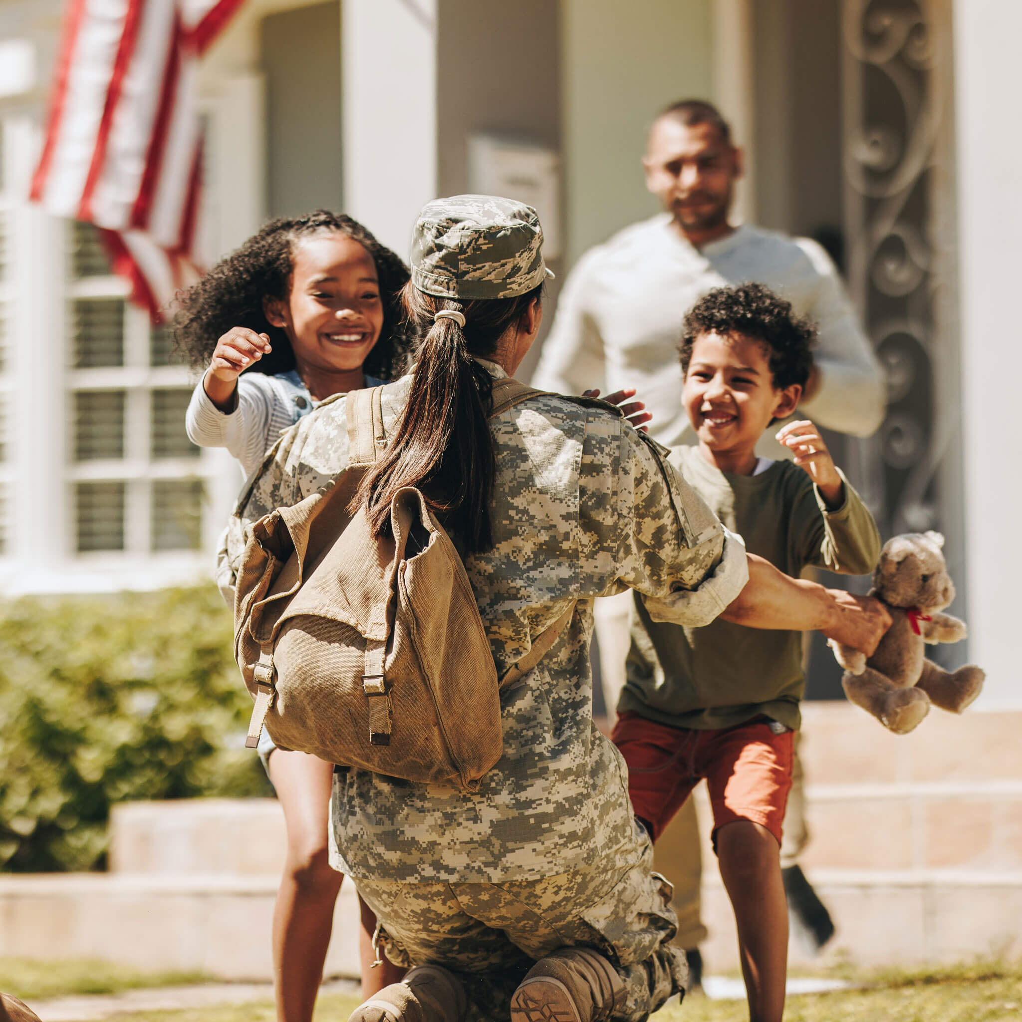Service member greeted by her children after returning home